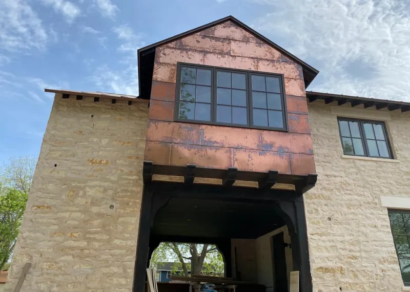 Copper metal panel facade on a stone building for Skylight Installation in Sandy Springs